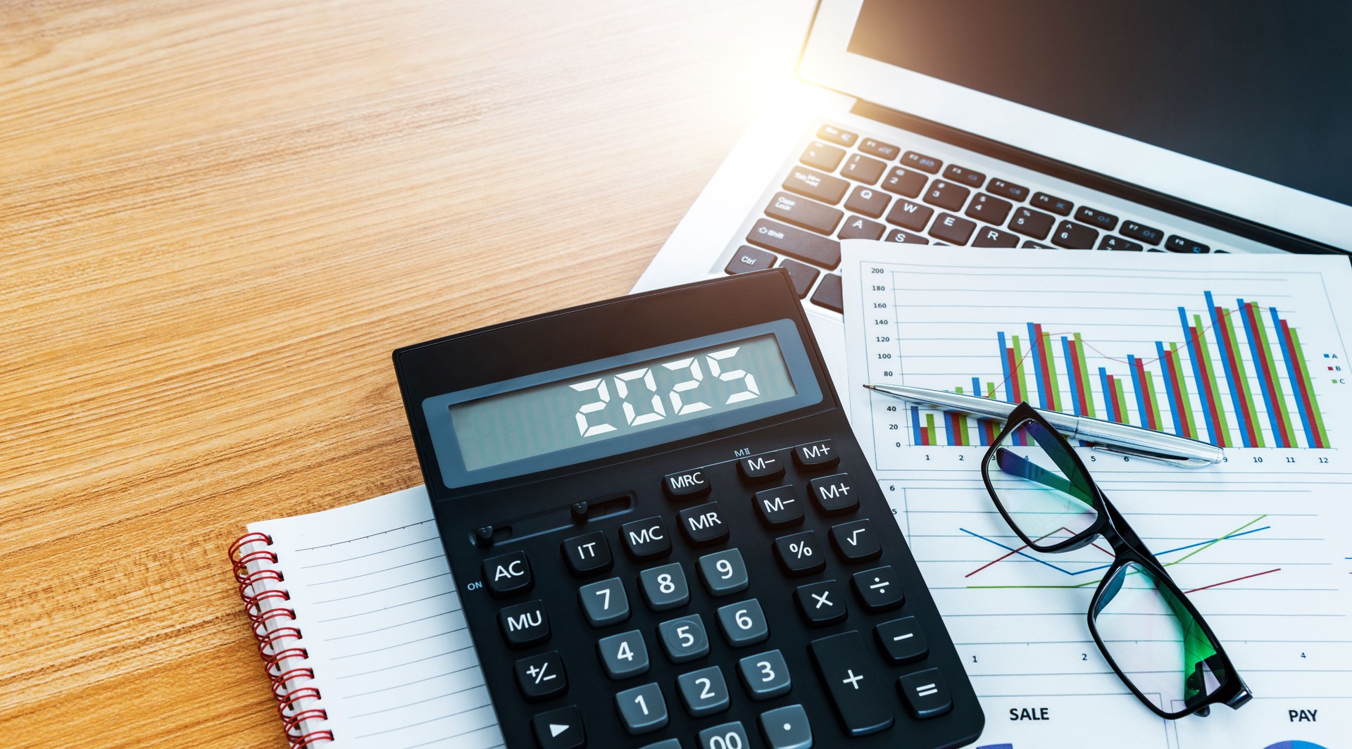 New year number 2025 on the calculator screen,  at financial analysis desk